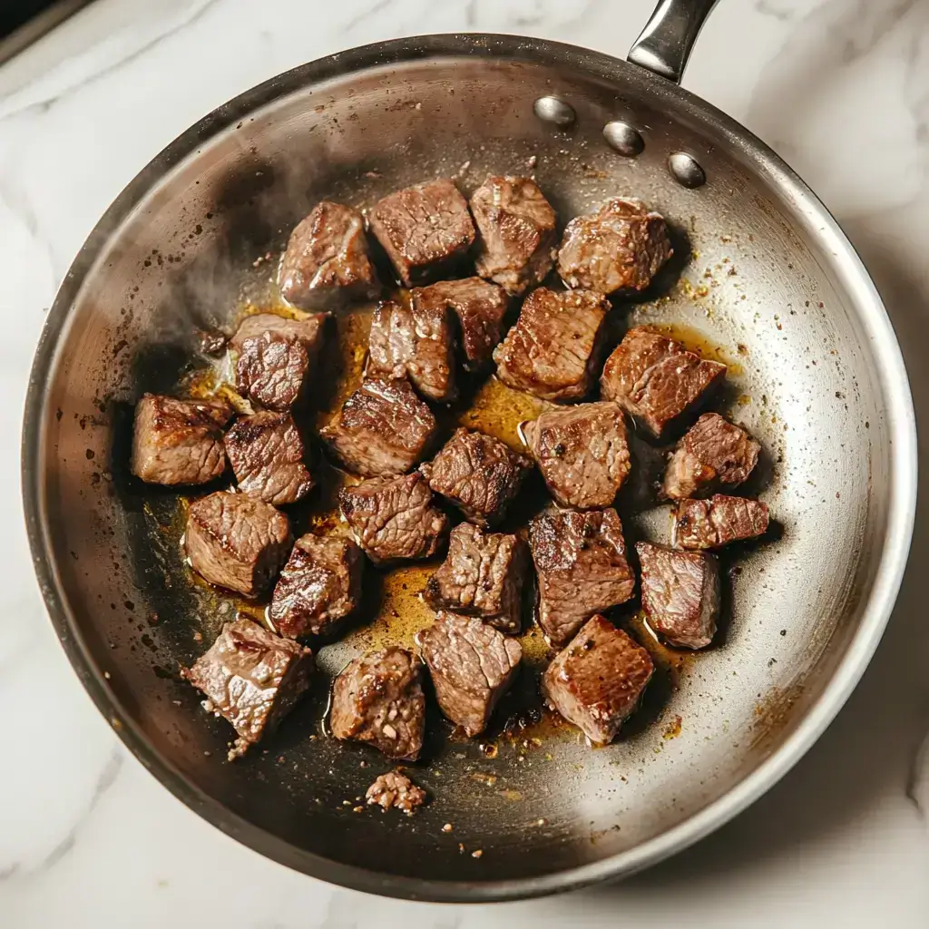 Low-FODMAP Slow-Cooker Recipe Beef and Potato Stew 2 Browning beef cubes in skillet for Low-FODMAP stew